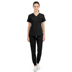 Vicogard Black jogger scrub set front view, sleek V-neck top with shoulder badge loop for estheticians