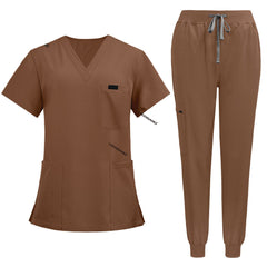 Flat lay of Coffee medical uniform featuring curved hem top and zipper pocket jogger pants