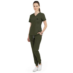 Side view of model using pockets on Army Green scrub pants, showing storage depth