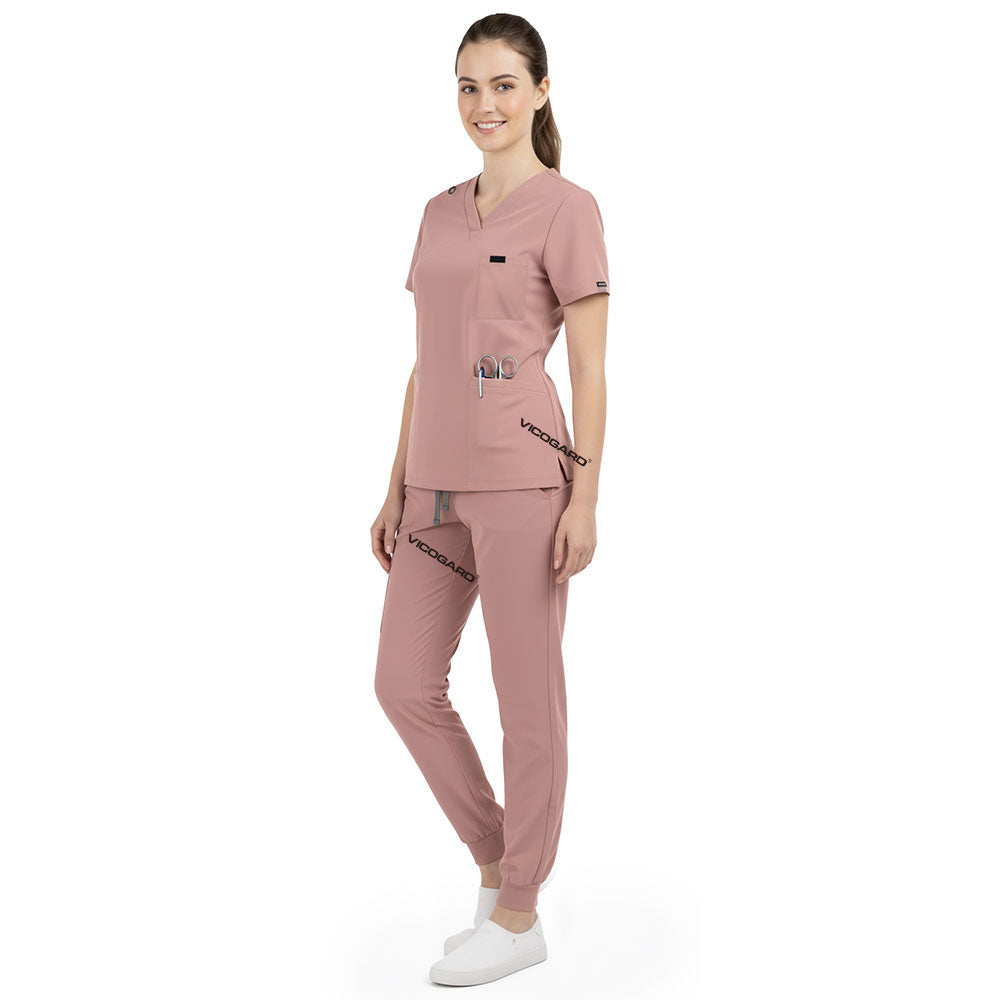 Side profile of Pink nursing joggers showing athletic fit and ribbed ankle cuffs