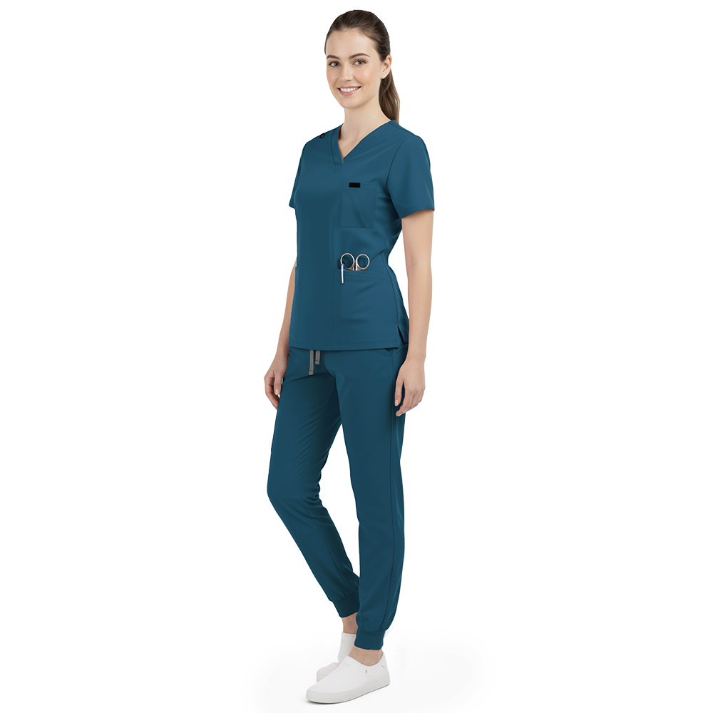 Side profile of Caribbean Blue nursing joggers showing athletic fit and ribbed ankle cuffs