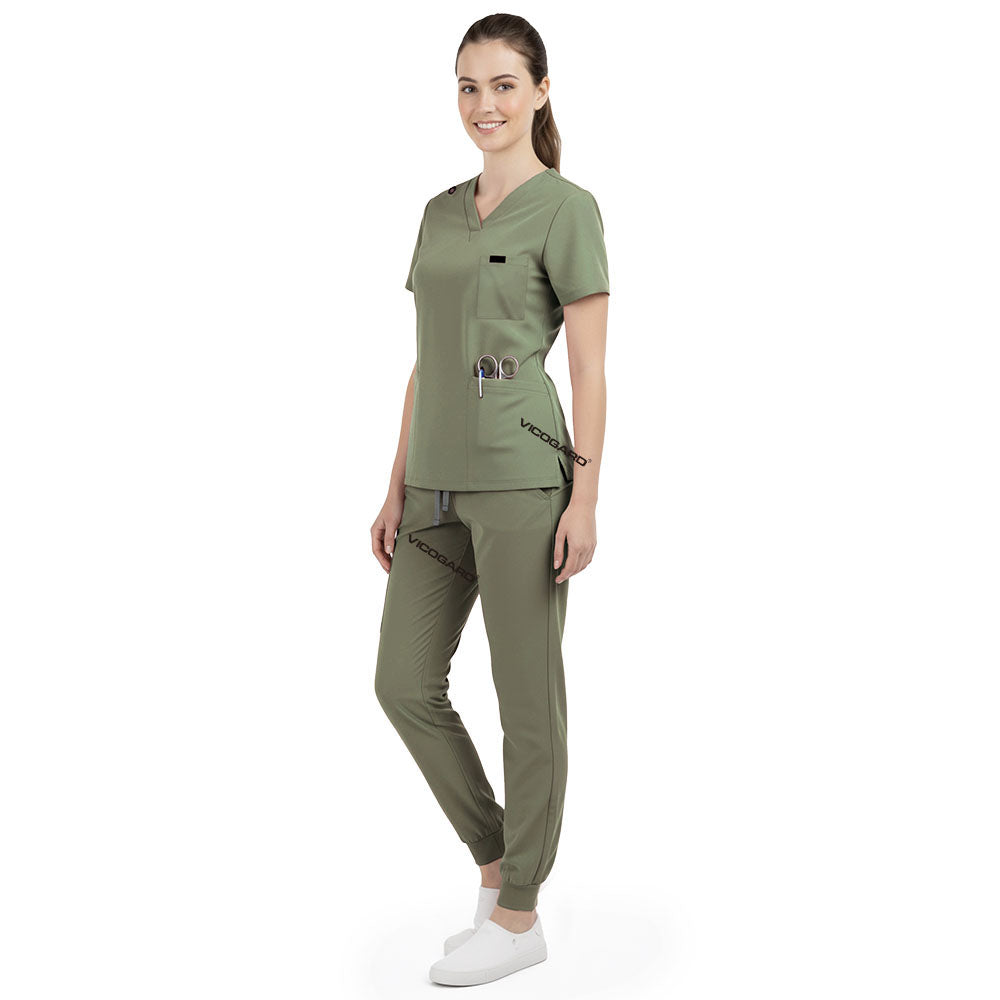 Side profile of Fruit Green nursing joggers showing athletic fit and ribbed ankle cuffs