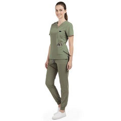 Side profile of Fruit Green nursing joggers showing athletic fit and ribbed ankle cuffs
