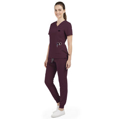 Side profile of Burgundy nursing joggers showing athletic fit and ribbed ankle cuffs