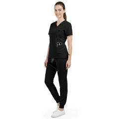 Side profile of Black nursing joggers showing slimming athletic fit and ribbed ankle cuffs