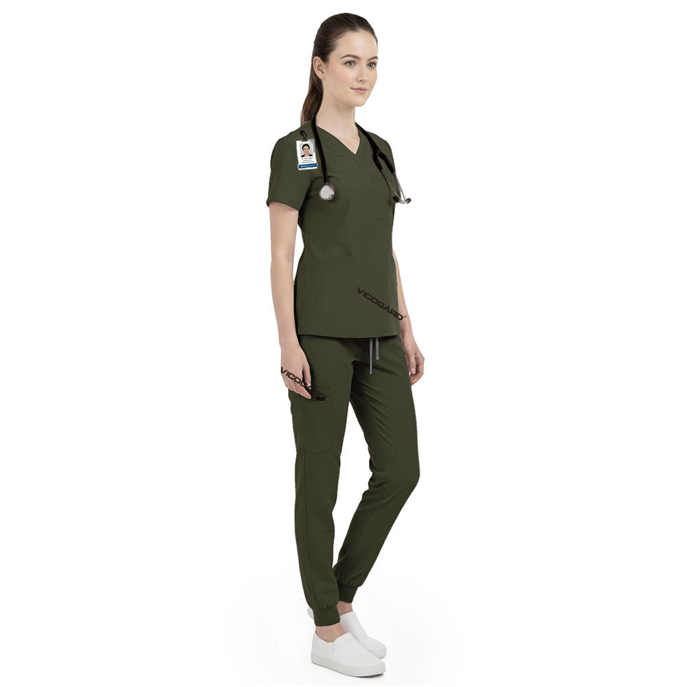 Side view of vet tech working in Army Green scrubs, showing durable professional look