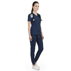 Side view of dental nurse working in Galaxy Blue scrubs, showing professional modern look
