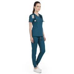 Side view of veterinary nurse working in Caribbean Blue scrubs, showing vibrant professional look