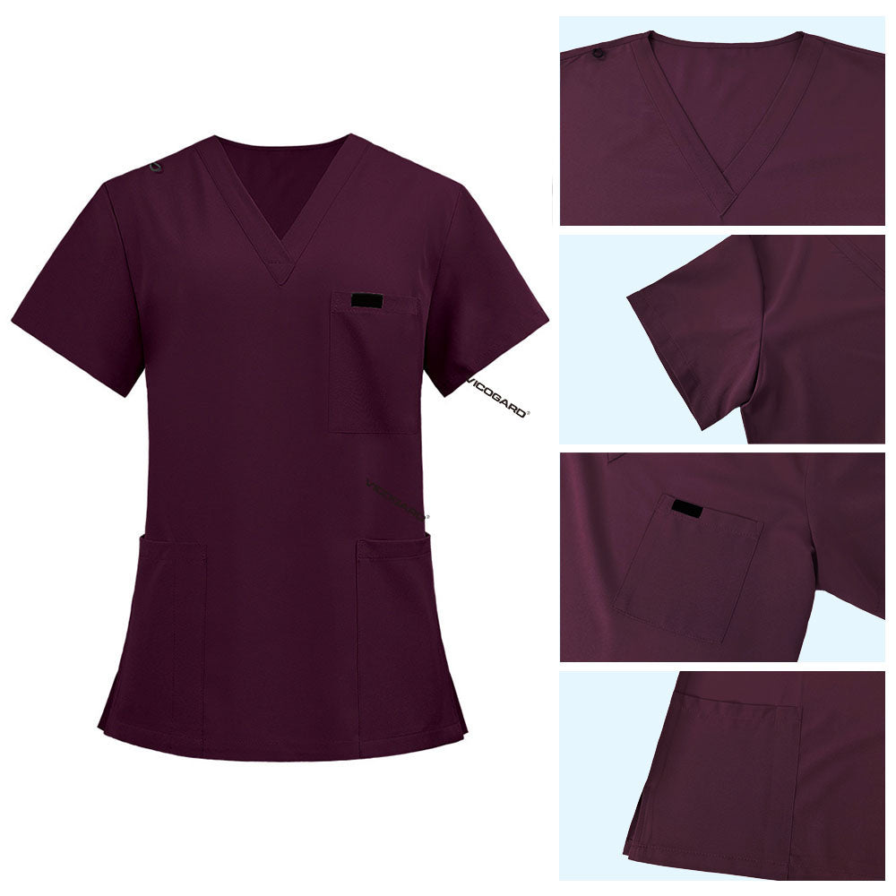 Detail of Burgundy scrub top shoulder D-ring loop for hanging ID badges and chest pocket flap