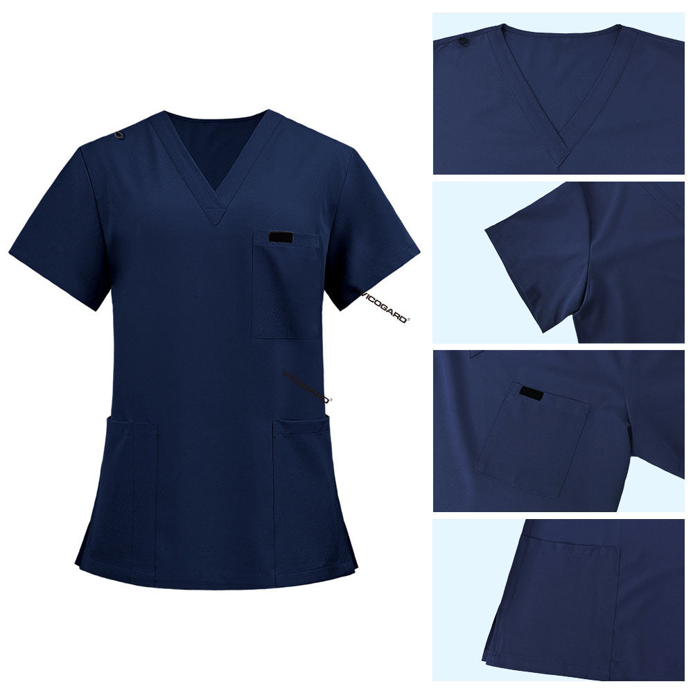 Detail of Galaxy Blue scrub top shoulder D-ring loop for hanging ID badges and chest pocket flap