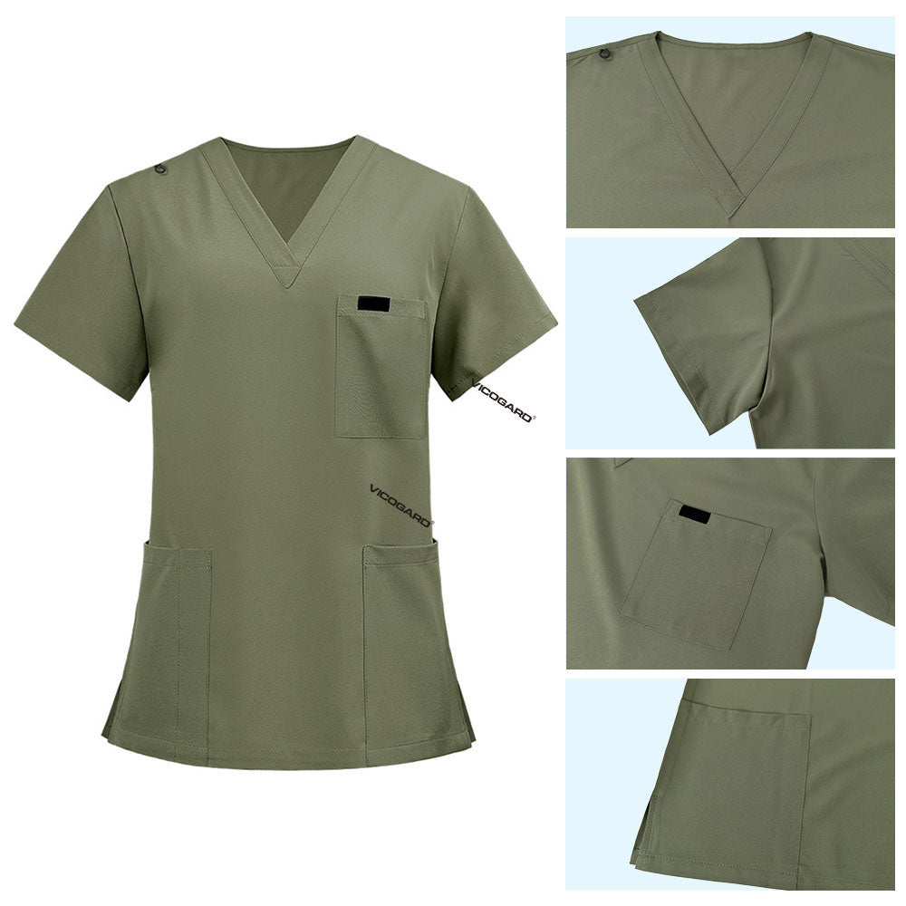 Detail of Fruit Green scrub top shoulder D-ring loop for hanging ID badges and chest pocket flap