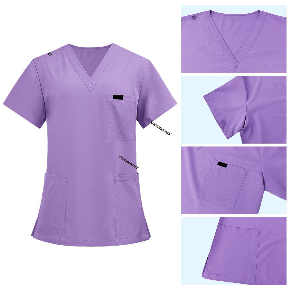 Detail of Lavender scrub top shoulder D-ring loop for hanging ID badges and chest pocket flap