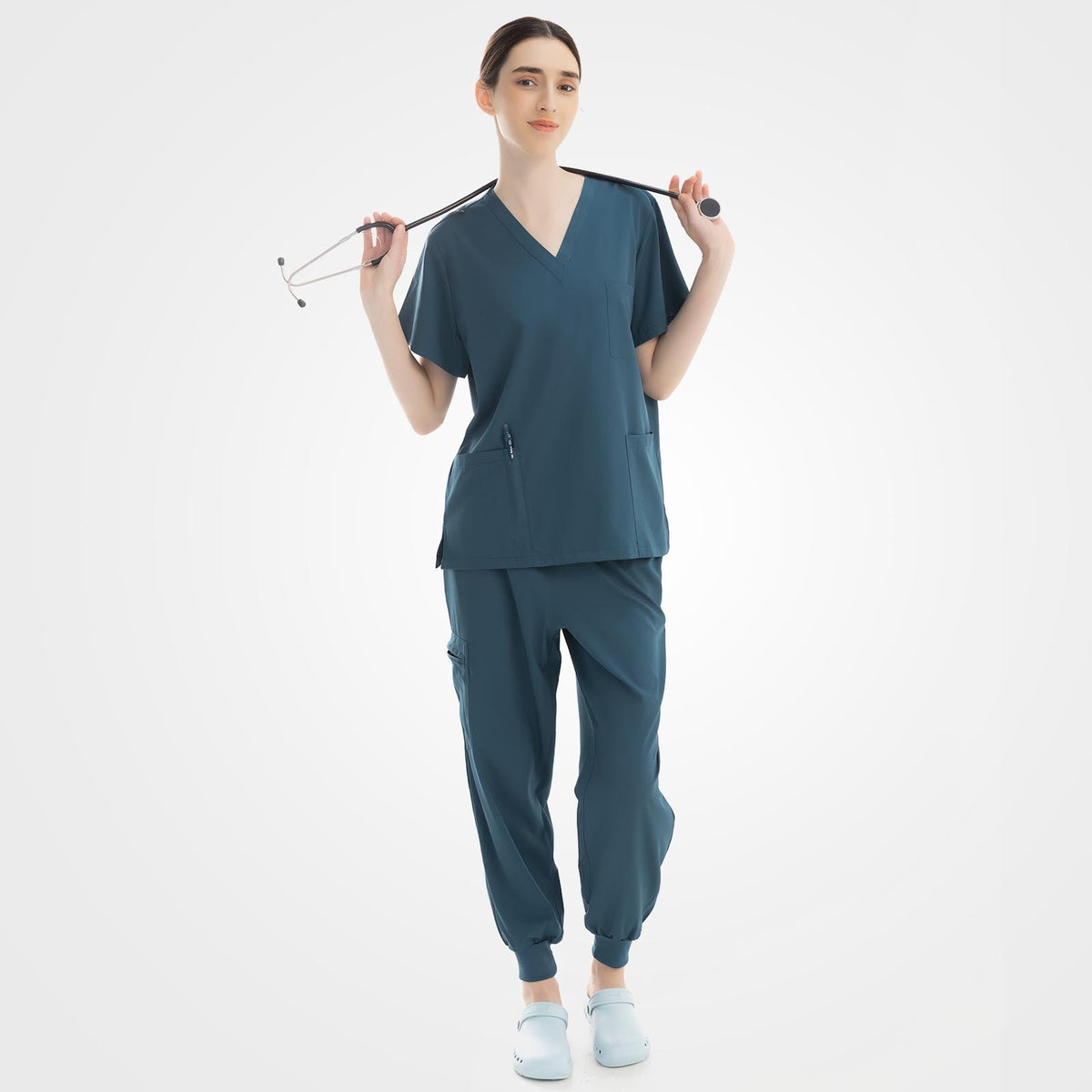 Vibrant caribbean blue V-neck scrub top and ribbed pants front view