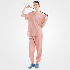 Vibrant pink V-neck scrub top and ribbed pants front