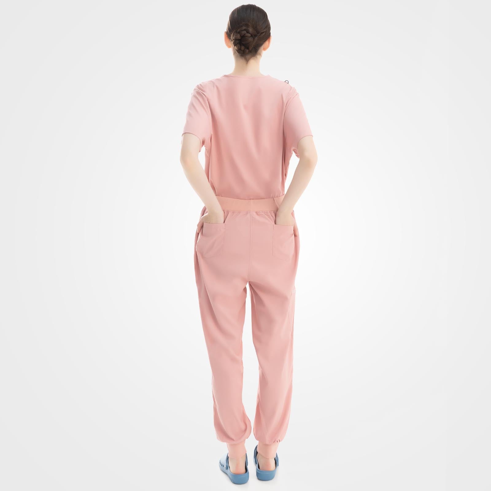 Women's pink scrub set back view showing shape retention