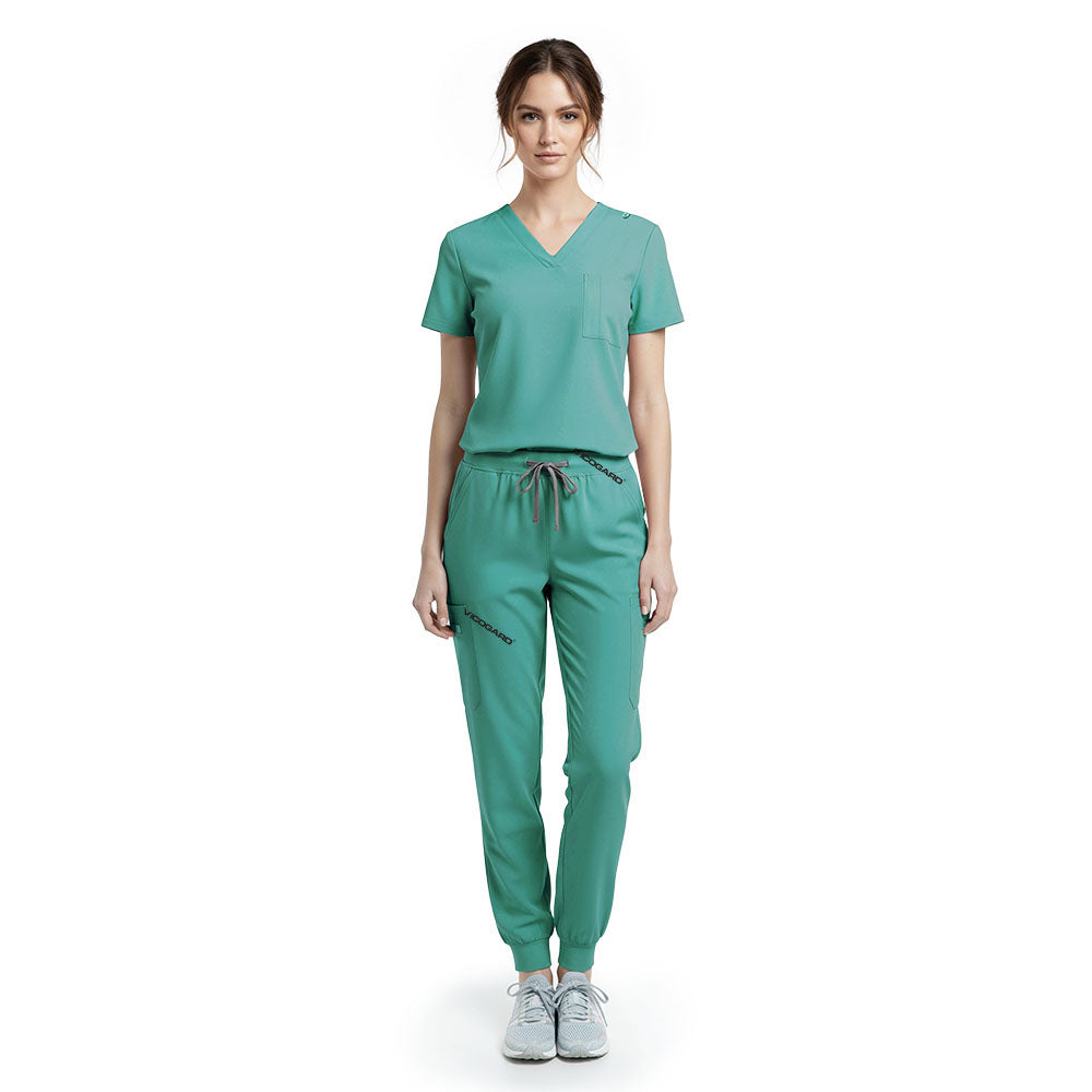 Vicogard Turquoise performance jogger scrub set front view, bright V-neck top with badge loop