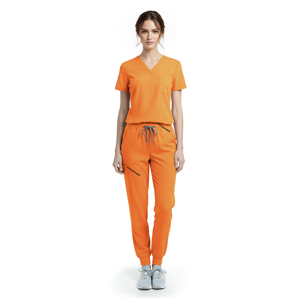 Vicogard Mango Yellow performance jogger scrub set front view, vibrant V-neck top with badge loop