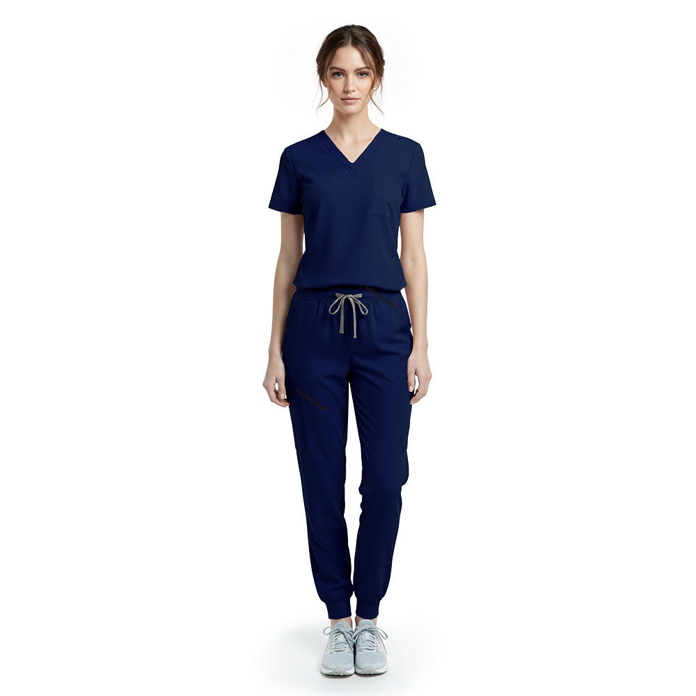 Vicogard Galaxy Blue performance jogger scrub set front view, modern V-neck top with badge loop