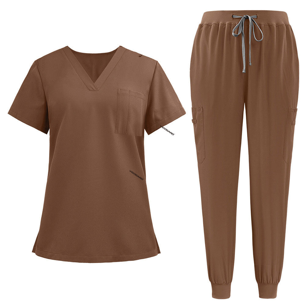 Flat lay of Coffee active medical uniform featuring streamlined top and 3-pocket pants
