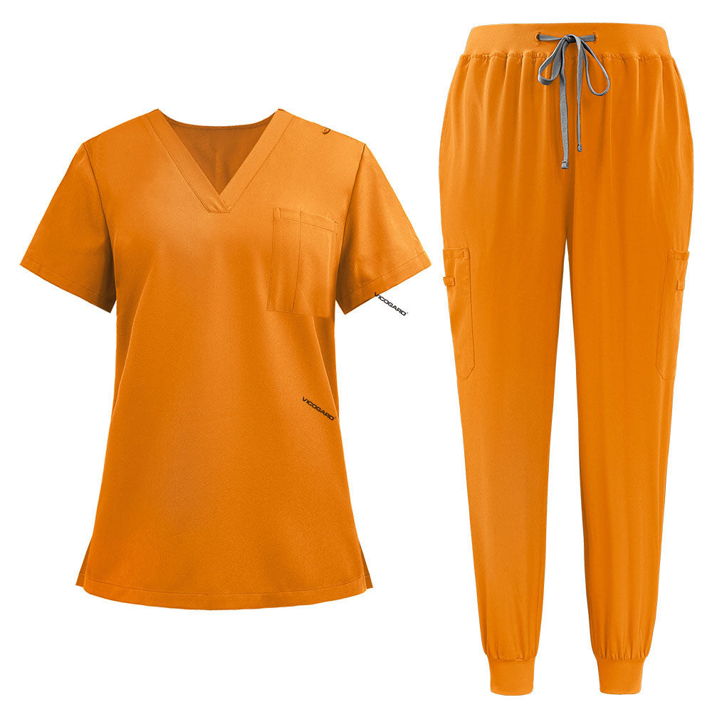 Flat lay of Mango Yellow active medical uniform featuring streamlined top and 3-pocket pants
