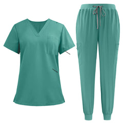 Flat lay of Turquoise active medical uniform featuring streamlined top and 3-pocket pants