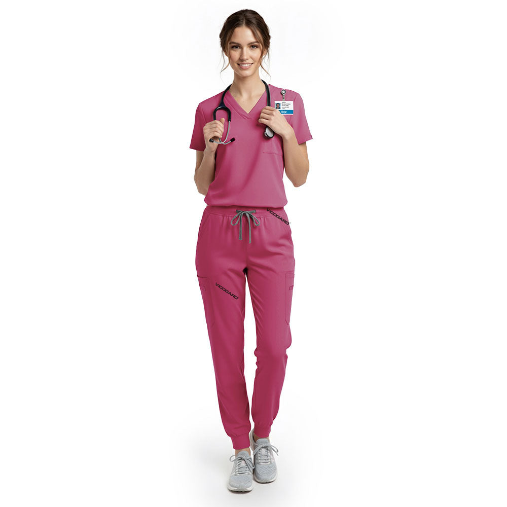 Nurse wearing Rose Pink performance scrubs showing support for breast cancer awareness