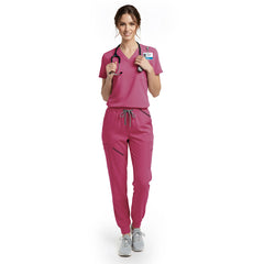 Nurse wearing Rose Pink performance scrubs showing support for breast cancer awareness