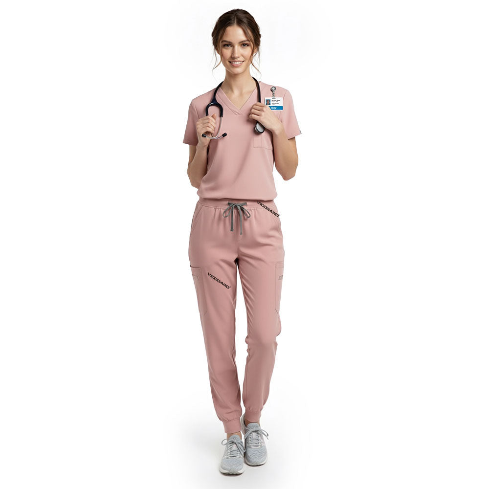 Pediatric nurse wearing Pink performance scrubs ready for active patient care