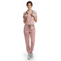 Pediatric nurse wearing Pink performance scrubs ready for active patient care