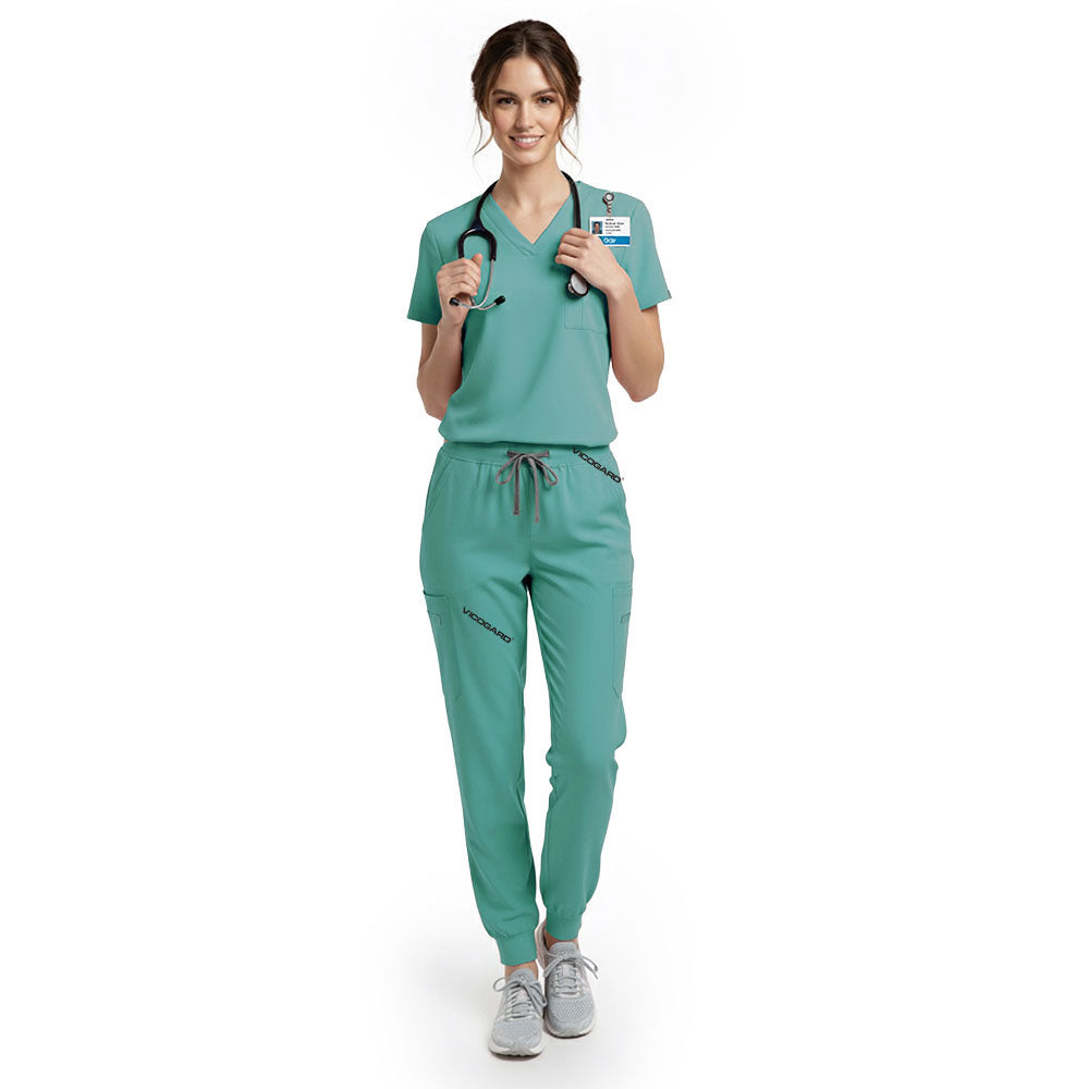 Dental hygienist wearing Turquoise performance scrubs ready for patient appointment