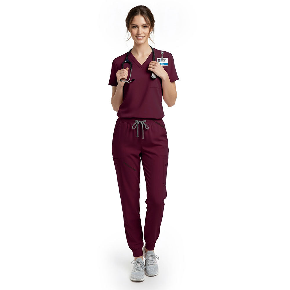 Nursing student wearing Burgundy performance scrubs ready for clinical rotations