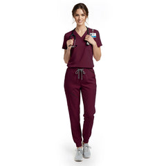 Nursing student wearing Burgundy performance scrubs ready for clinical rotations