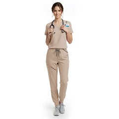 Esthetician wearing Apricot performance scrubs ready for client skincare consultation