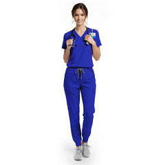Medical professional wearing Royal Blue scrubs with stethoscope, ready for rounds