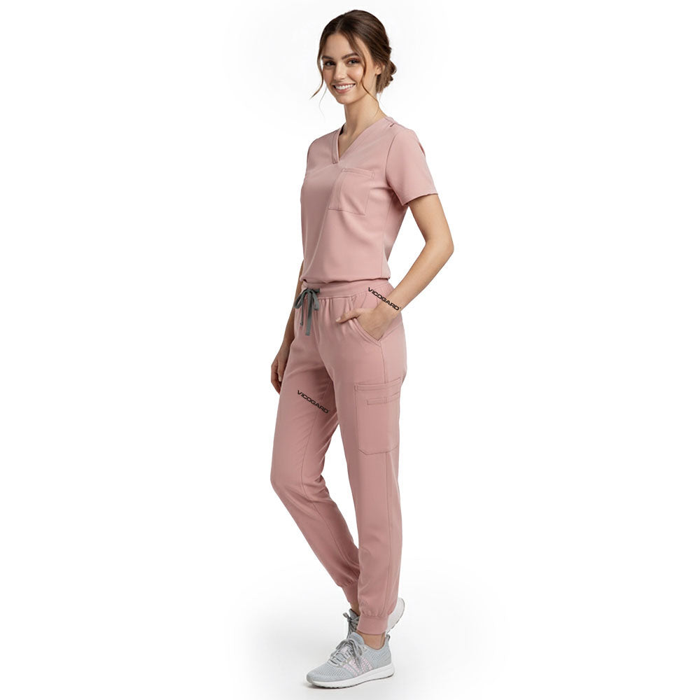 Side view of model using streamlined cargo pocket on Pink scrub pants, showing non-bulky storage