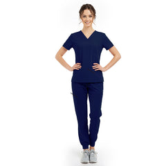 Model pose highlighting the tailored waist silhouette of the Galaxy Blue performance scrub top