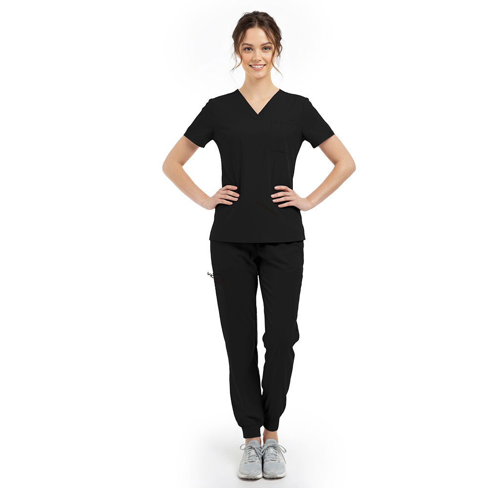 Model pose highlighting the tailored waist silhouette of the Black performance scrub top