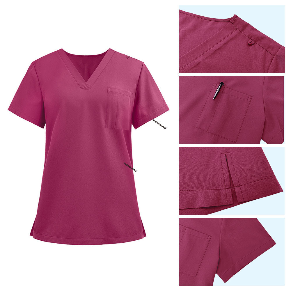 Detail of Rose Pink scrub top shoulder D-ring loop and minimalist chest pocket