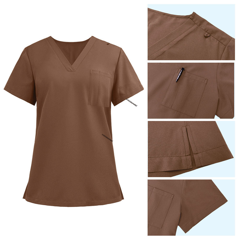 Detail of Coffee scrub top shoulder D-ring loop and minimalist chest pocket