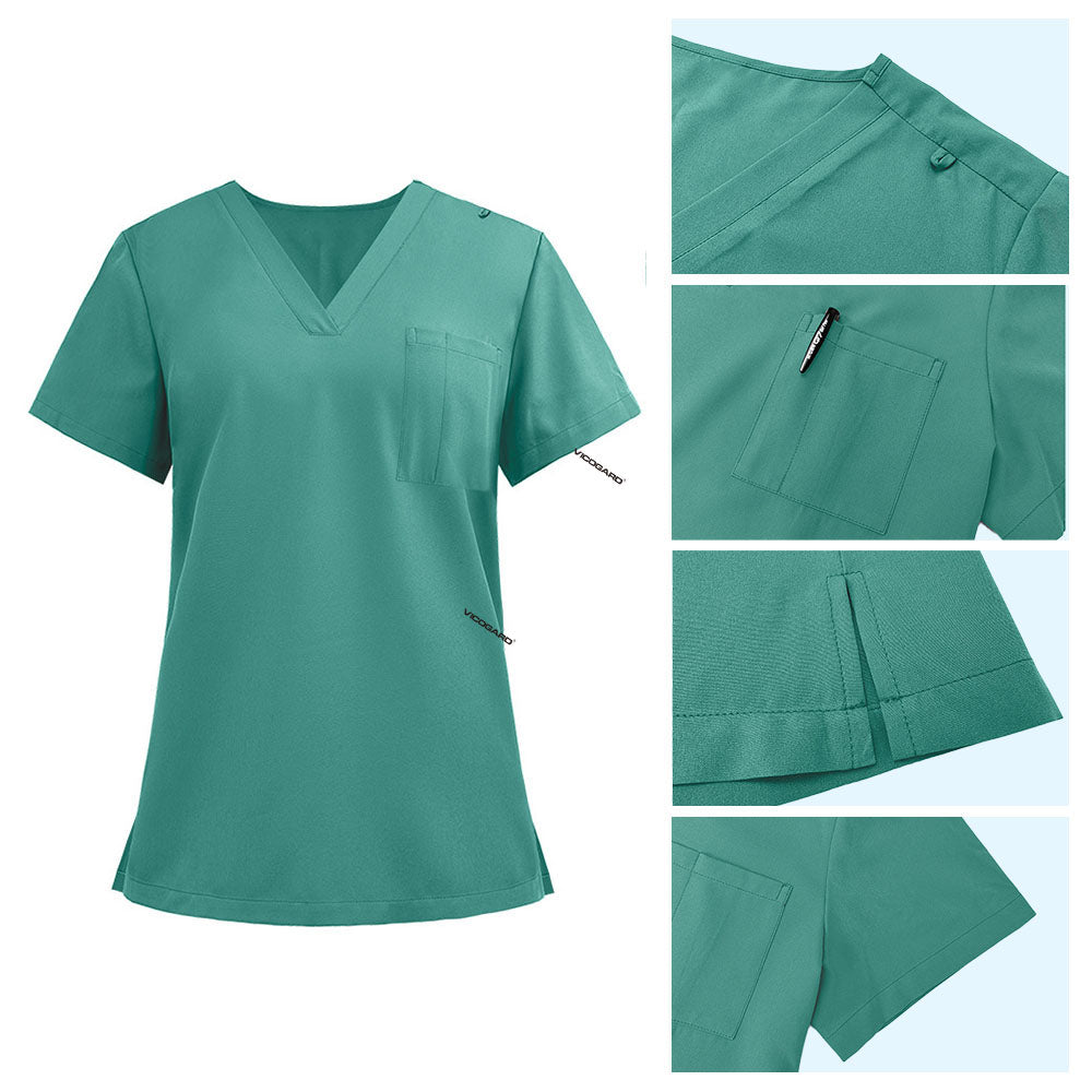 Detail of Turquoise scrub top shoulder D-ring loop and minimalist chest pocket