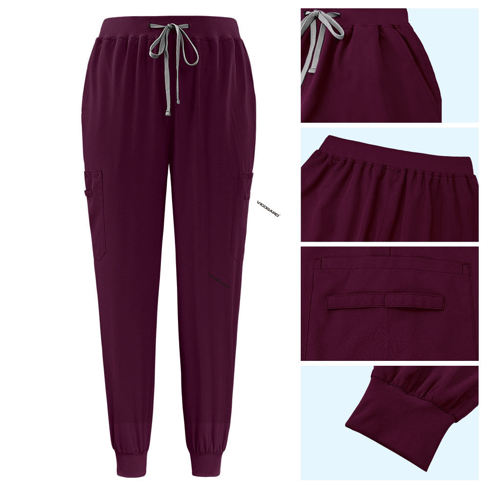 Detail of Burgundy active jogger pants with elastic waistband and durable side pocket