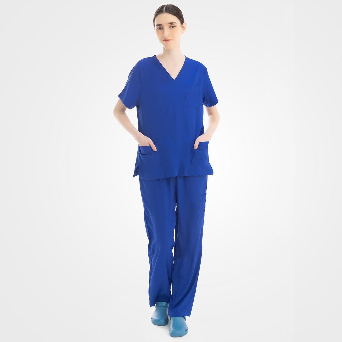 Women's royal blue scrub top and cargo pants front view