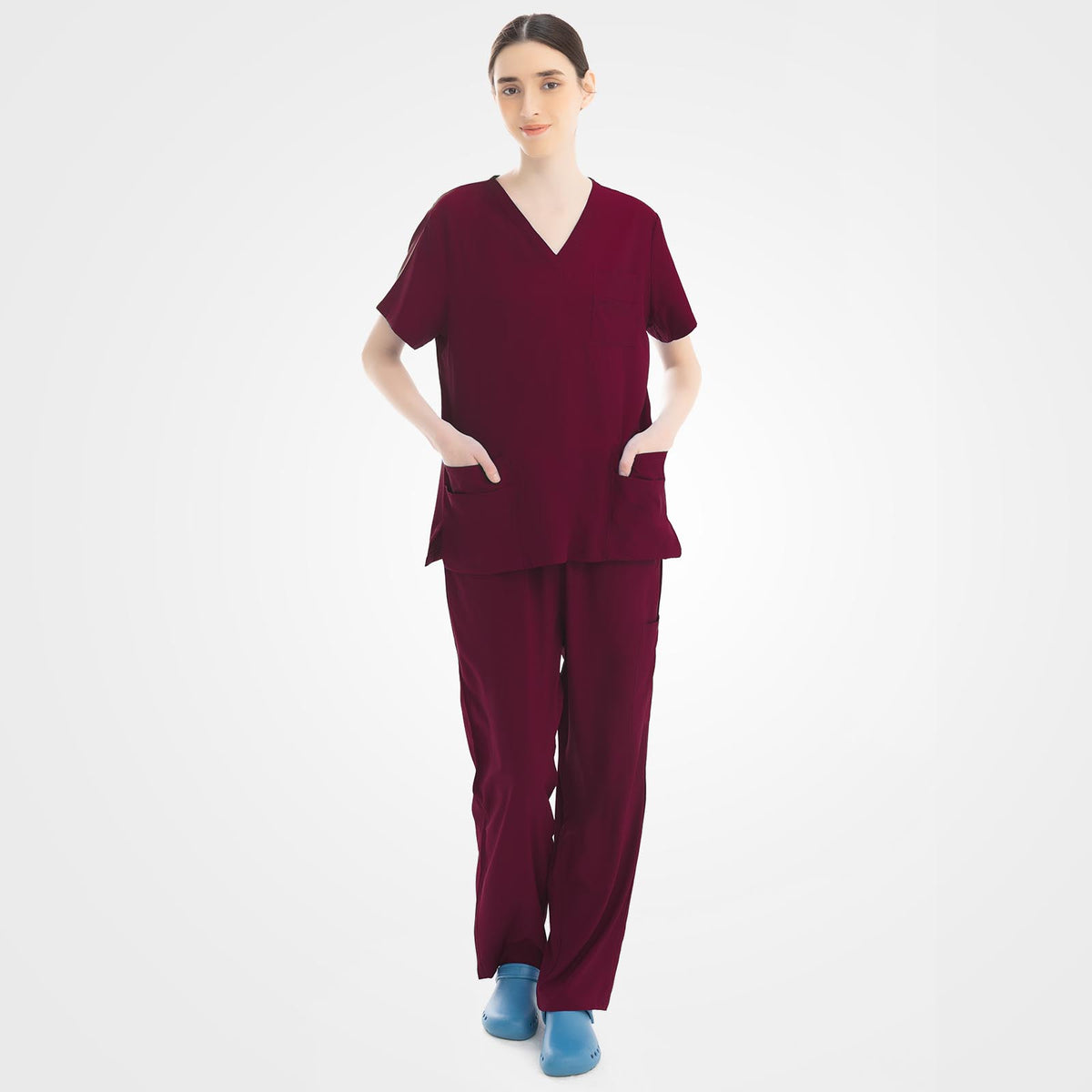Women's burgundy scrub top and cargo pants front view