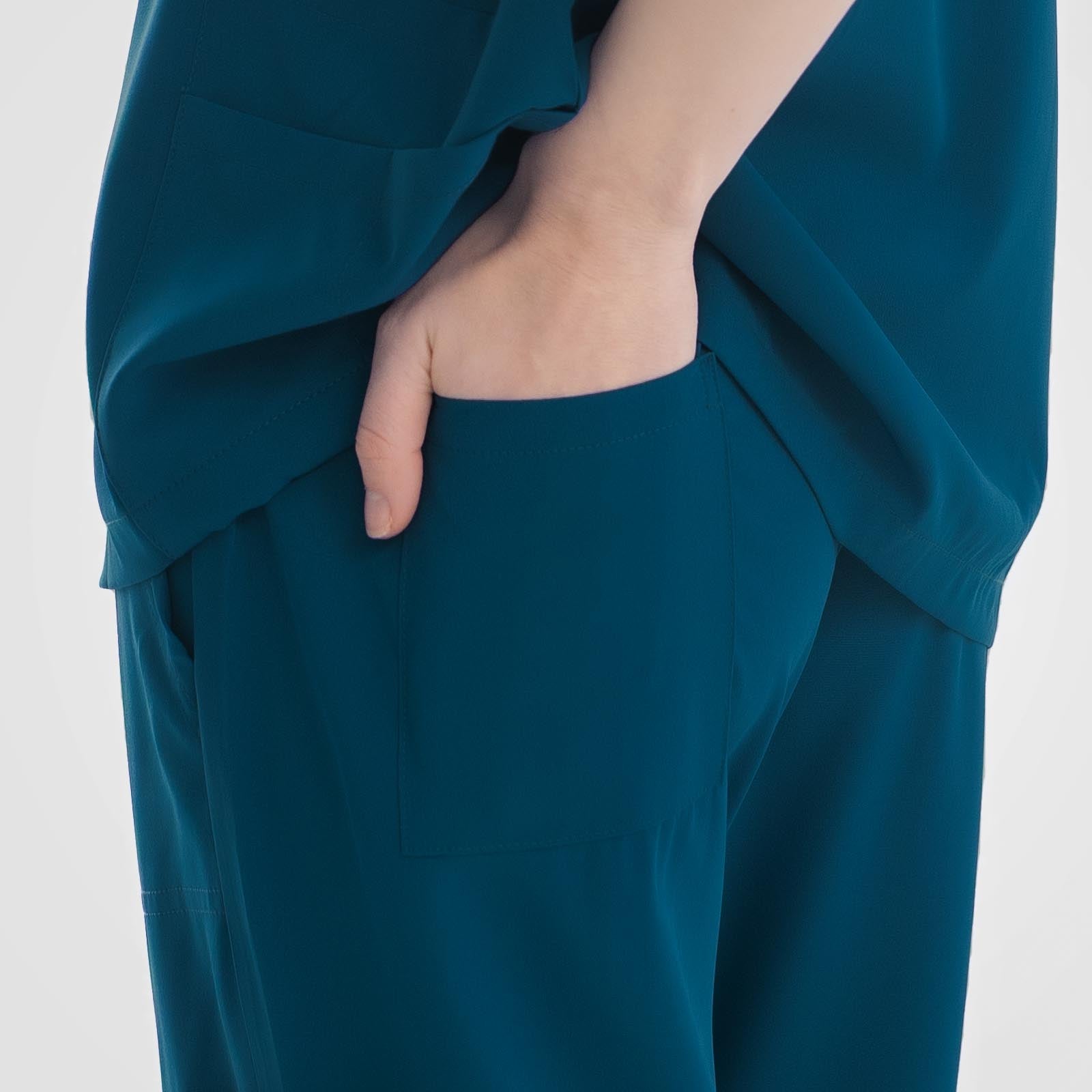 Caribbean blue scrub pants woman secure back pocket
