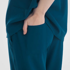 Caribbean blue scrub pants woman secure back pocket