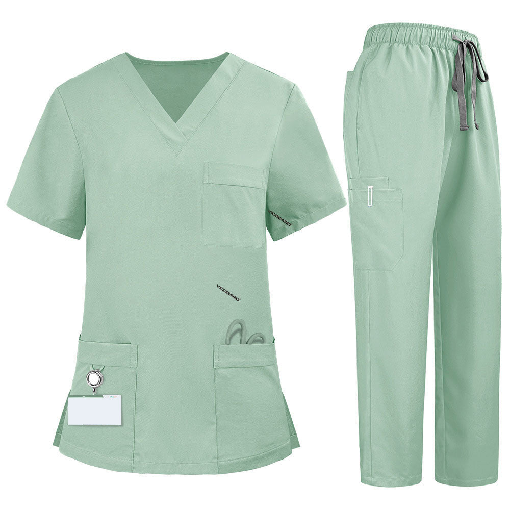Flat lay of Avocado Green medical uniform featuring V-neck top with bungee loop and 7-pocket cargo pants