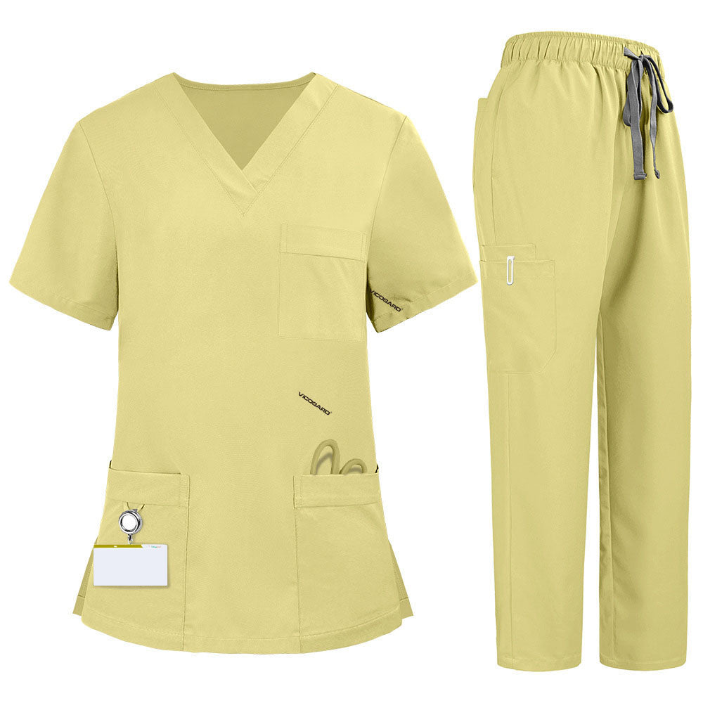 Flat lay of Cream Yellow medical uniform featuring V-neck top with bungee loop and 7-pocket cargo pants