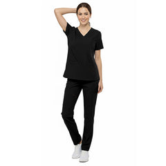 Front view of nurse walking in Black straight leg scrubs, showing sleek fit and 4-way stretch