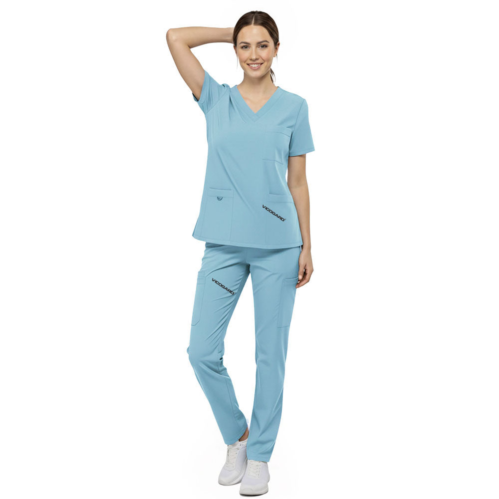 Front view of nurse walking in Marine Blue straight leg scrubs, showing professional fit and 4-way stretch