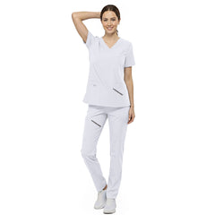 Front view of nurse walking in White straight leg scrubs, showing comfortable 4-way stretch fit
